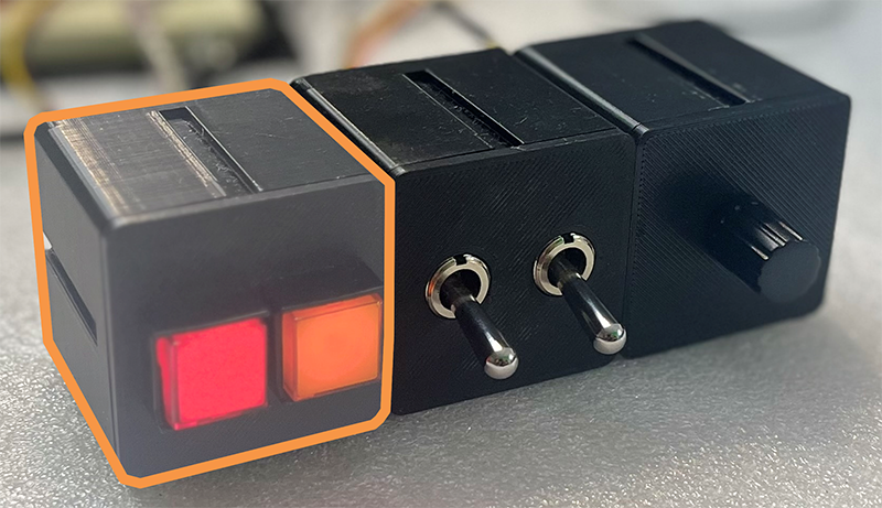 Photo of the beginner project with the two square LED buttons highlighted.