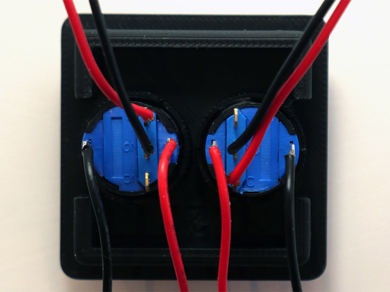 Photo of two LED push buttons mounted on the lid.